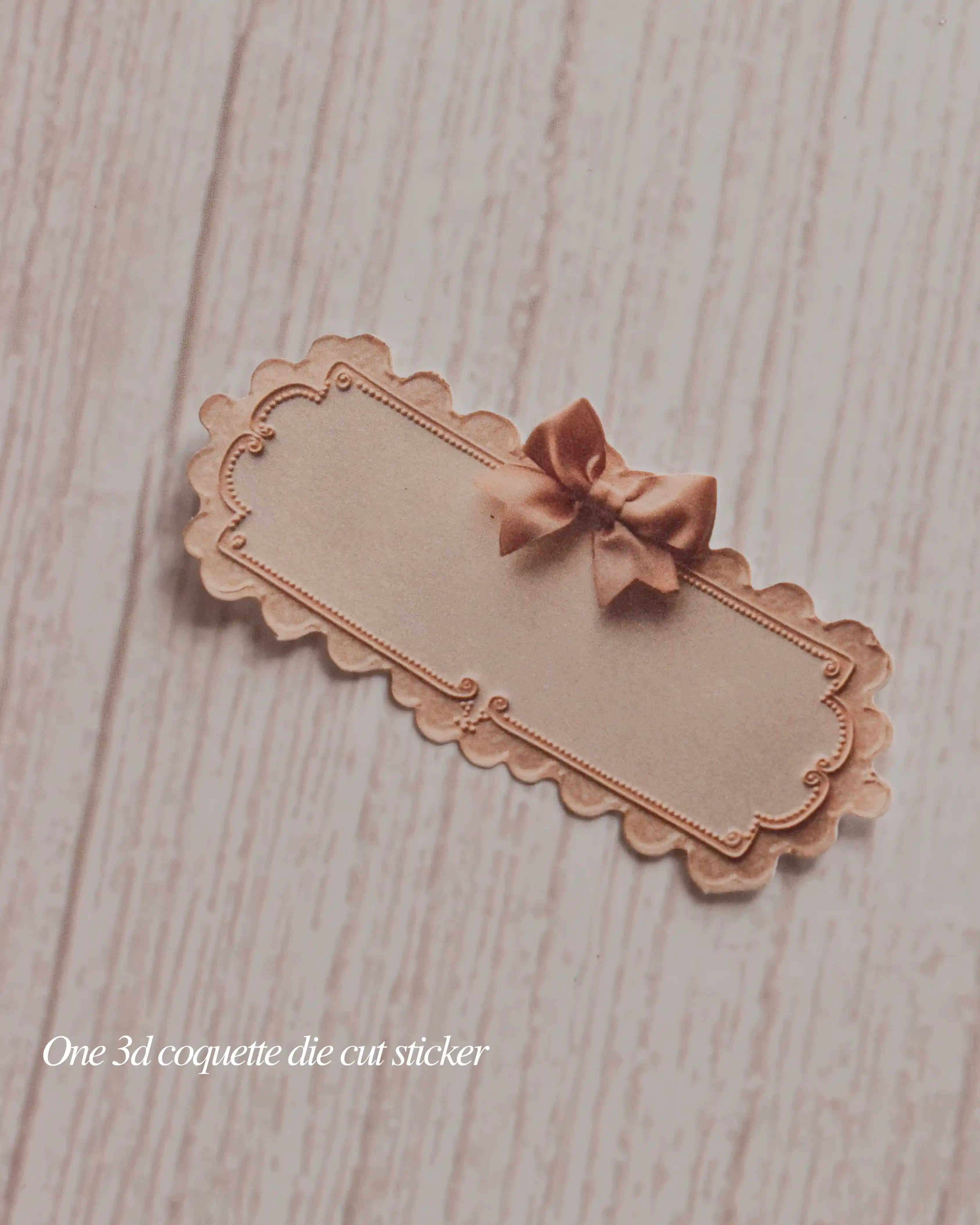 Decorative die-cut sticker with a bow on a wooden surface