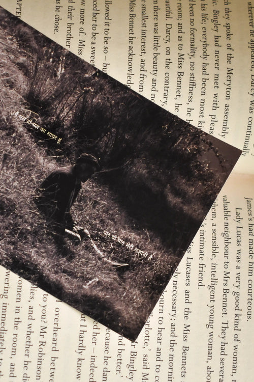 Angled close-up of the Wisdom of the Hills Chakrata Portrait Photo Print resting on an open book, featuring a vintage black and white photograph of a Pahari elder with the Hindi lyrics Main pal do pal ka shayar hoon.