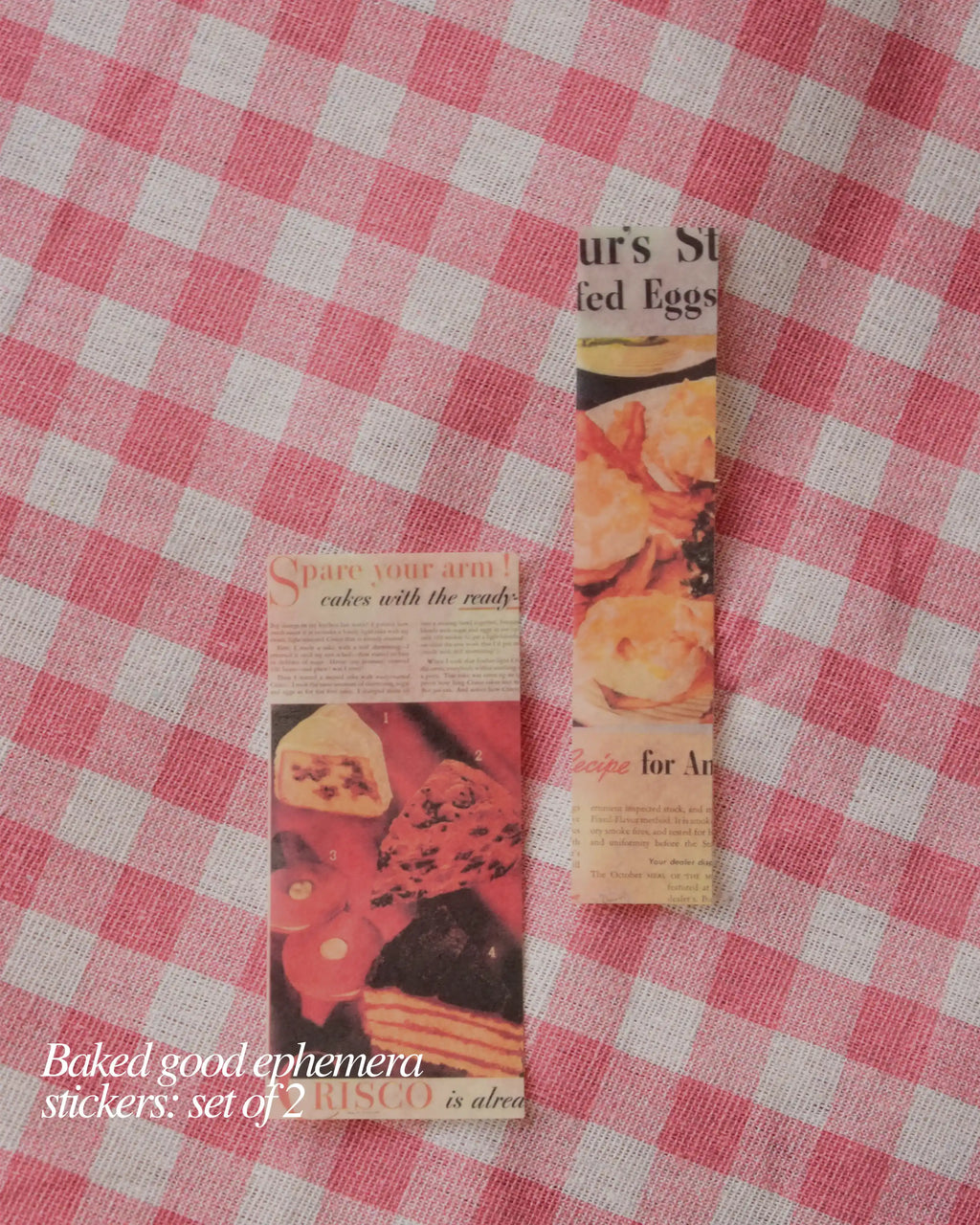 Set of two baked goods ephemera stickers cut from vintage newspaper and featuring illustrations of cakes and pastries.