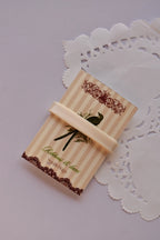 Narrow beige satin ribbon (6mm, 2 Metres) wrapped tightly across a "Sunlit Hugs" card, highlighting the sleek, smooth texture.