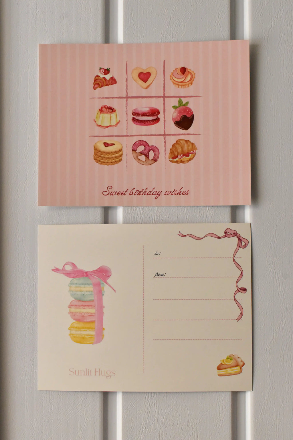 This side-by-side view displays the complete Birthday Bakes Postcard design, illustrating the grid of nine desserts and the elegant macaron tower on the address side.