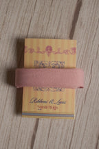 Blush pink grain ribbon wrapped around a printed Sunlit Hugs ribbon card, showing its soft colour and textured finish for gift wrapping and crafts.