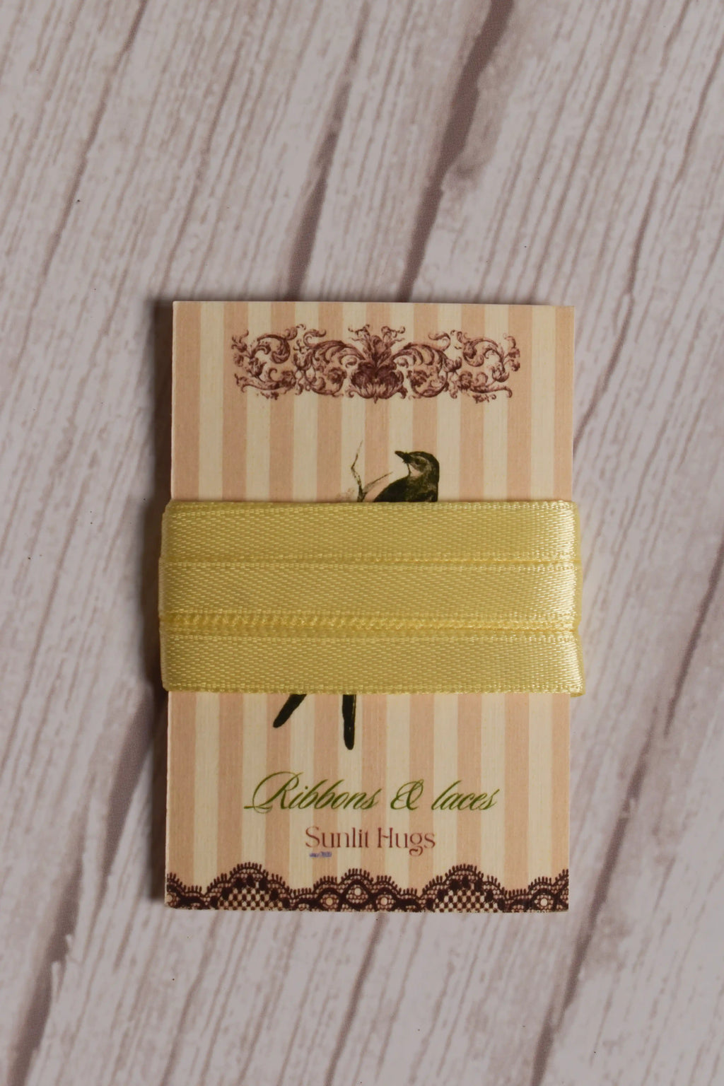 Butter Cream Satin Ribbon displayed on a printed Sunlit Hugs ribbon card, showing its 6 mm width, soft shine, and light yellow tone.
