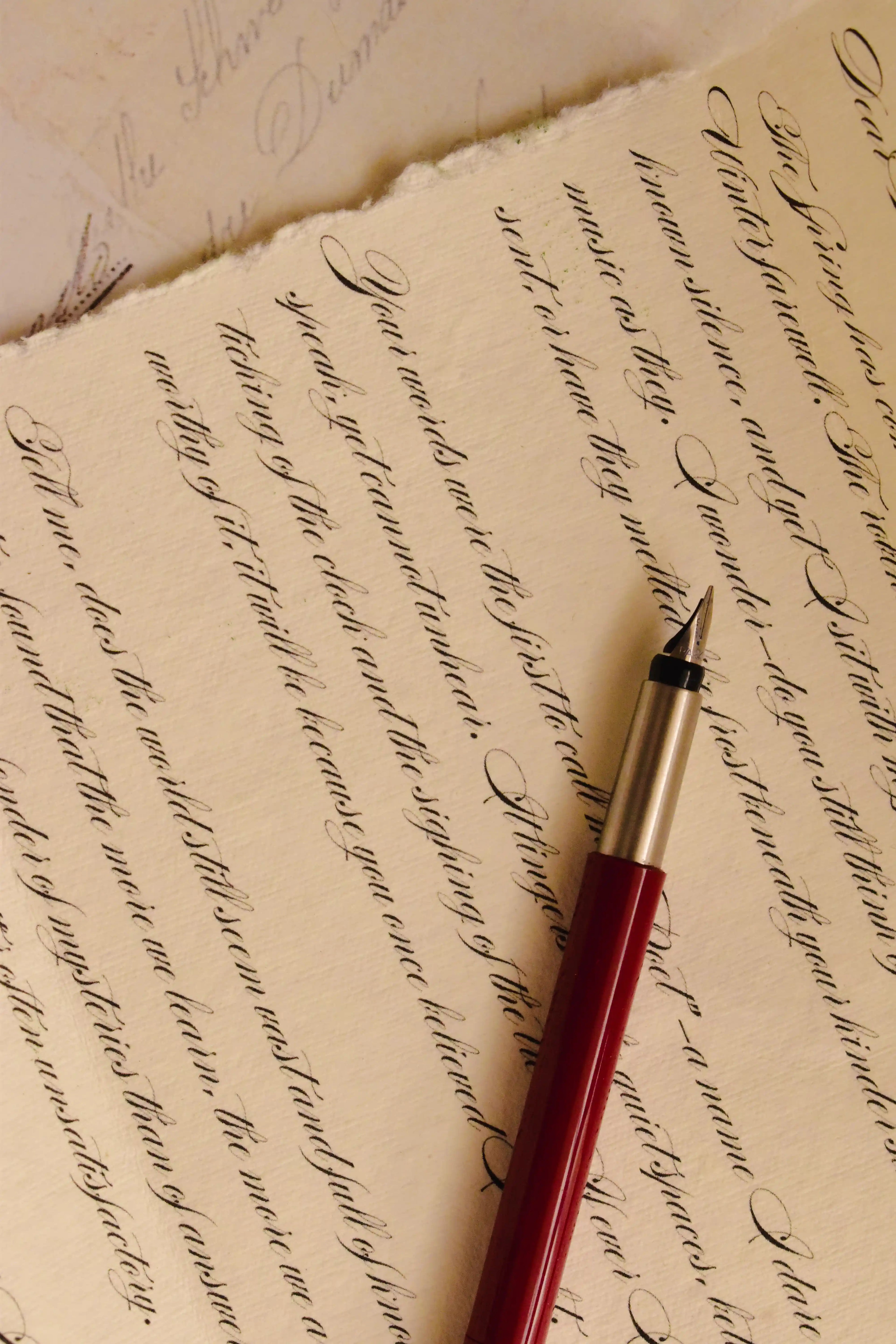 An immersive, angled view of the handmade vintage paper and the beautiful calligraphy script, emphasizing the dedication and care taken with the personalised romantic message.