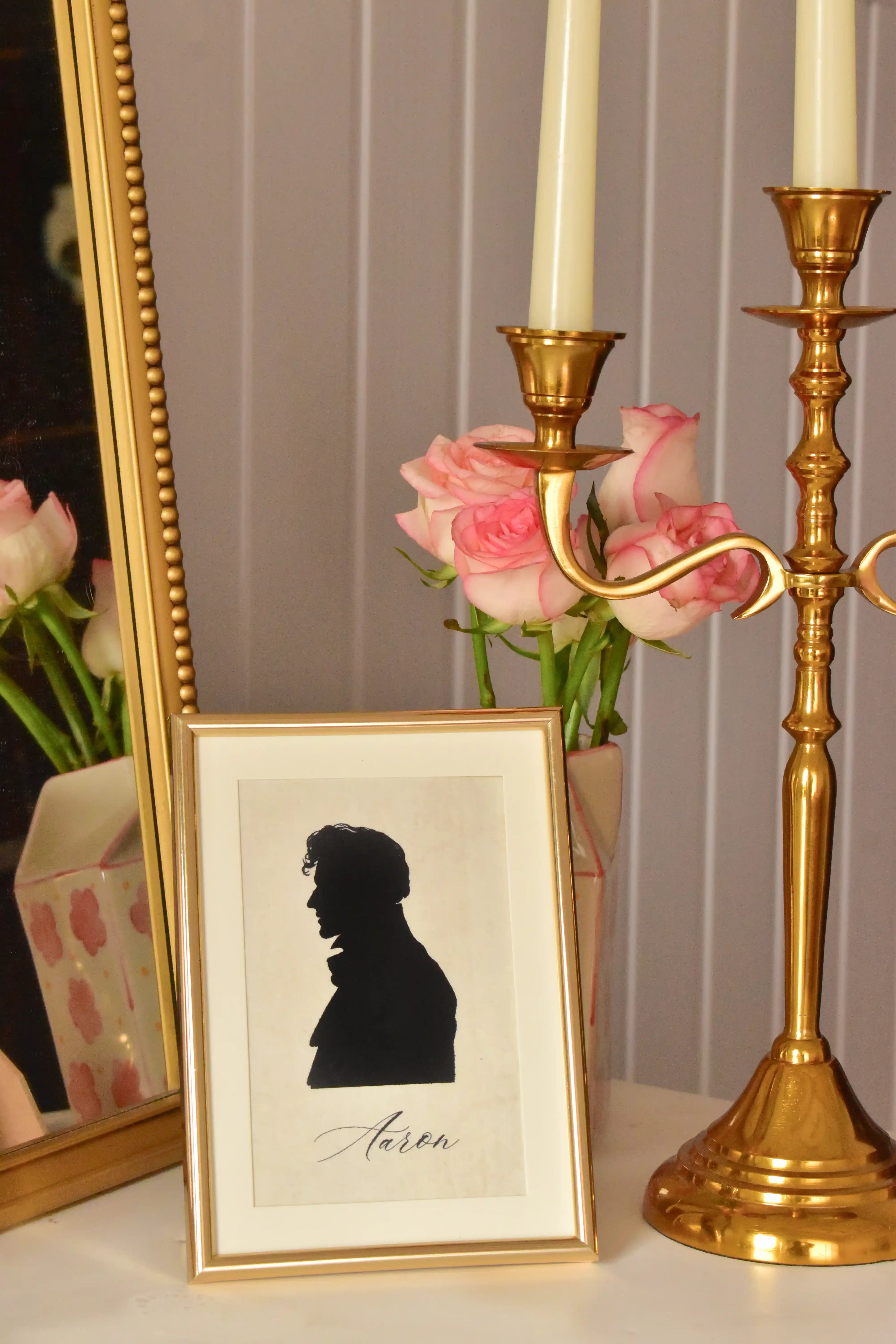 This image showcases the vintage charm of the Aaron silhouette portrait as a piece of home décor, demonstrating how the golden frame elevates the portrait into a nostalgic heirloom.