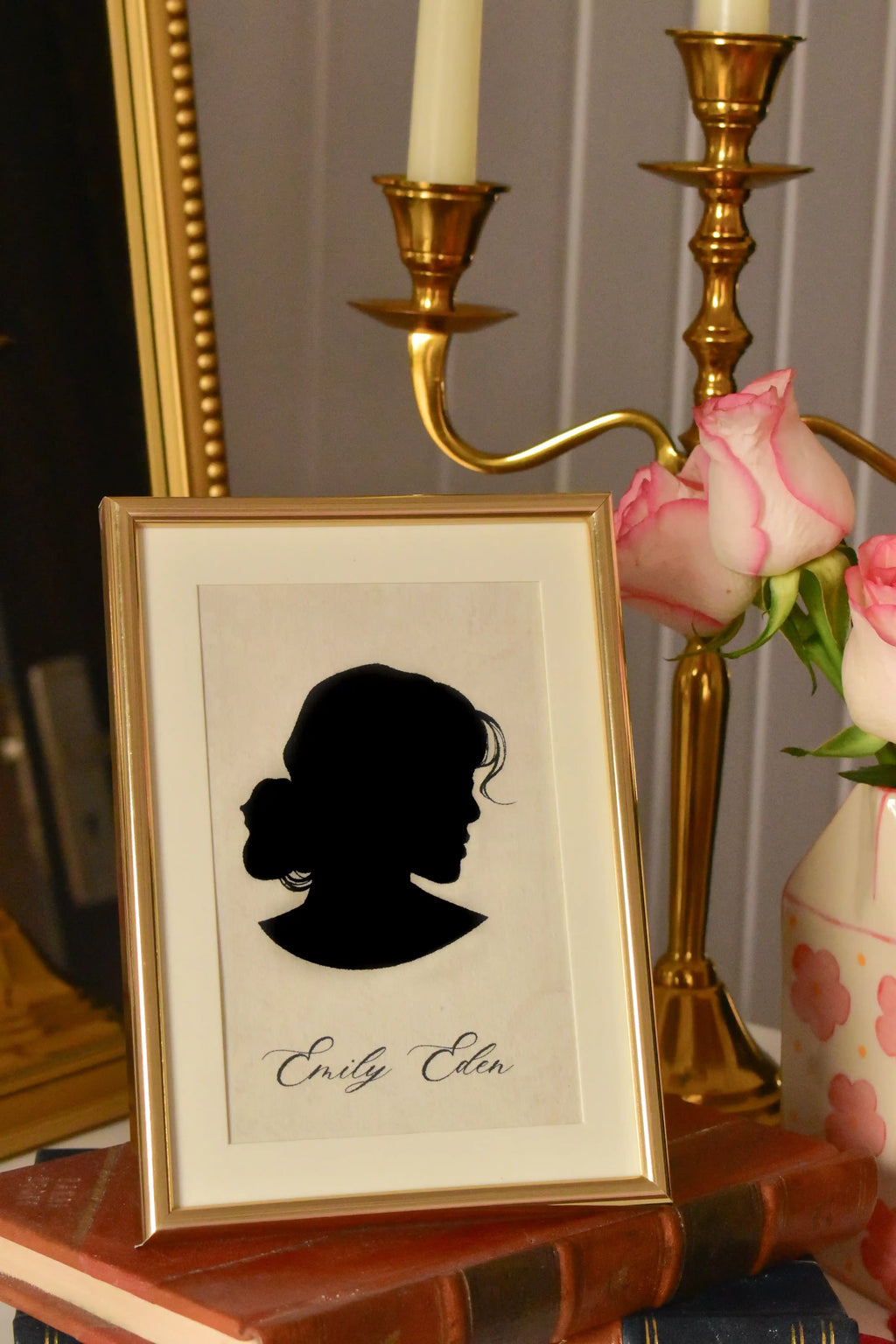  A warm, close-up of the Emily Eden silhouette, emphasizing the classic profile and the golden frame. The staging highlights its use as a charming, personal gift.