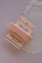 Soft pink velvet ribbon (15mm wide, 2 Metres) draped around a "Sunlit Hugs" card on a white lace doily.