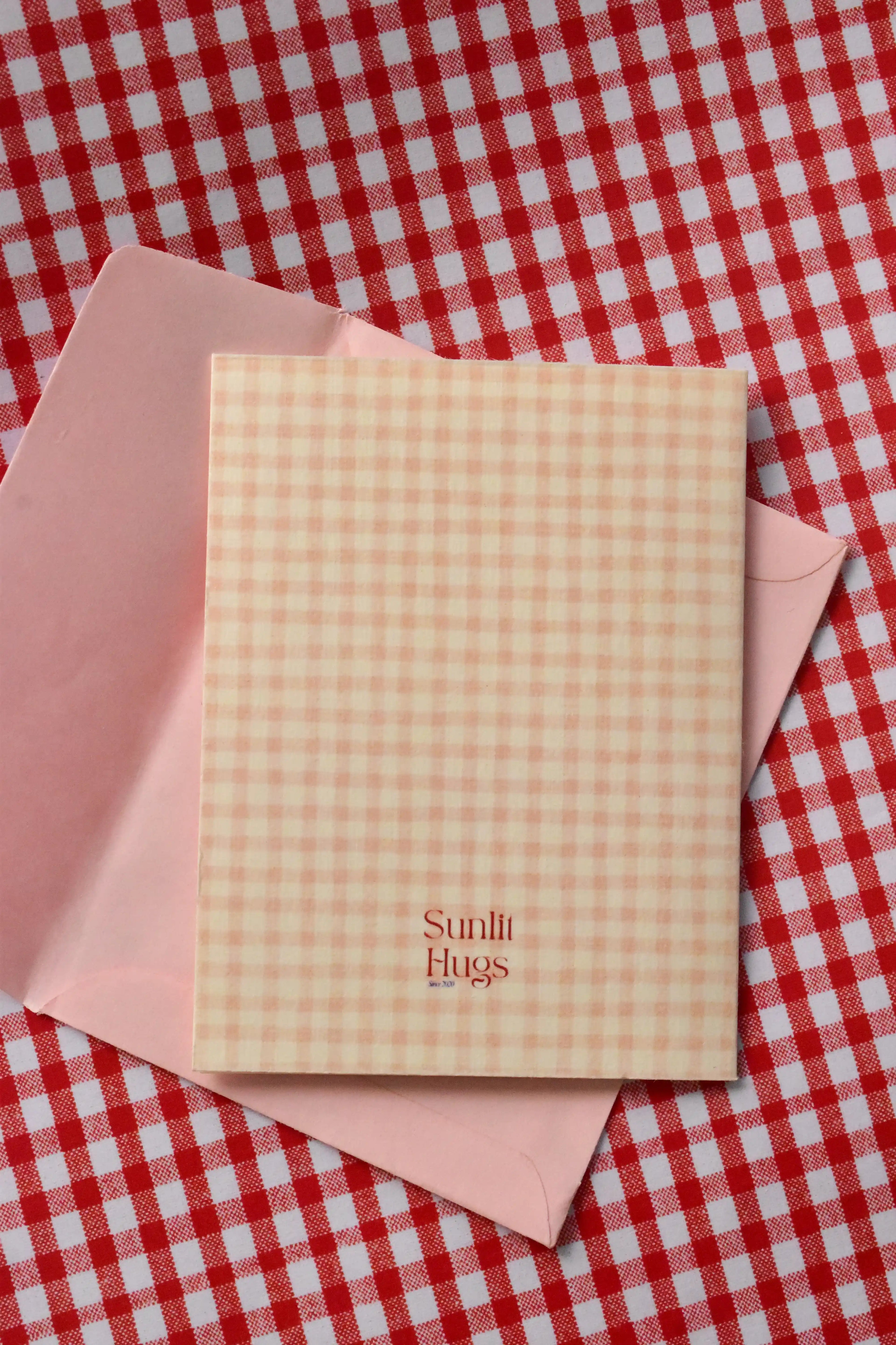 This image displays the back of the Happiest Birthday To You card, confirming the cosy pink and cream gingham design.