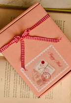 This image confirms the charming, ready-to-gift packaging, showing the 'Happy Mail' box sealed with a gingham ribbon, ensuring the letter arrives as a joyful surprise.