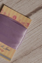 Close-up of Lavender Song Ribbon displayed on a Sunlit Hugs ribbon card, showing its soft lavender purple colour and smooth decorative finish.