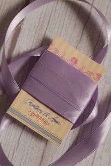 Lavender Song Ribbon shown with loose lavender purple ribbon strands around the product card, suitable for craft projects, packaging, scrapbooking, and decorative bows.