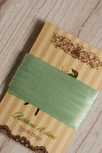 Close-up of Mint Breeze Ribbon displayed on a Sunlit Hugs card, highlighting its mint green tone and smooth decorative finish.
