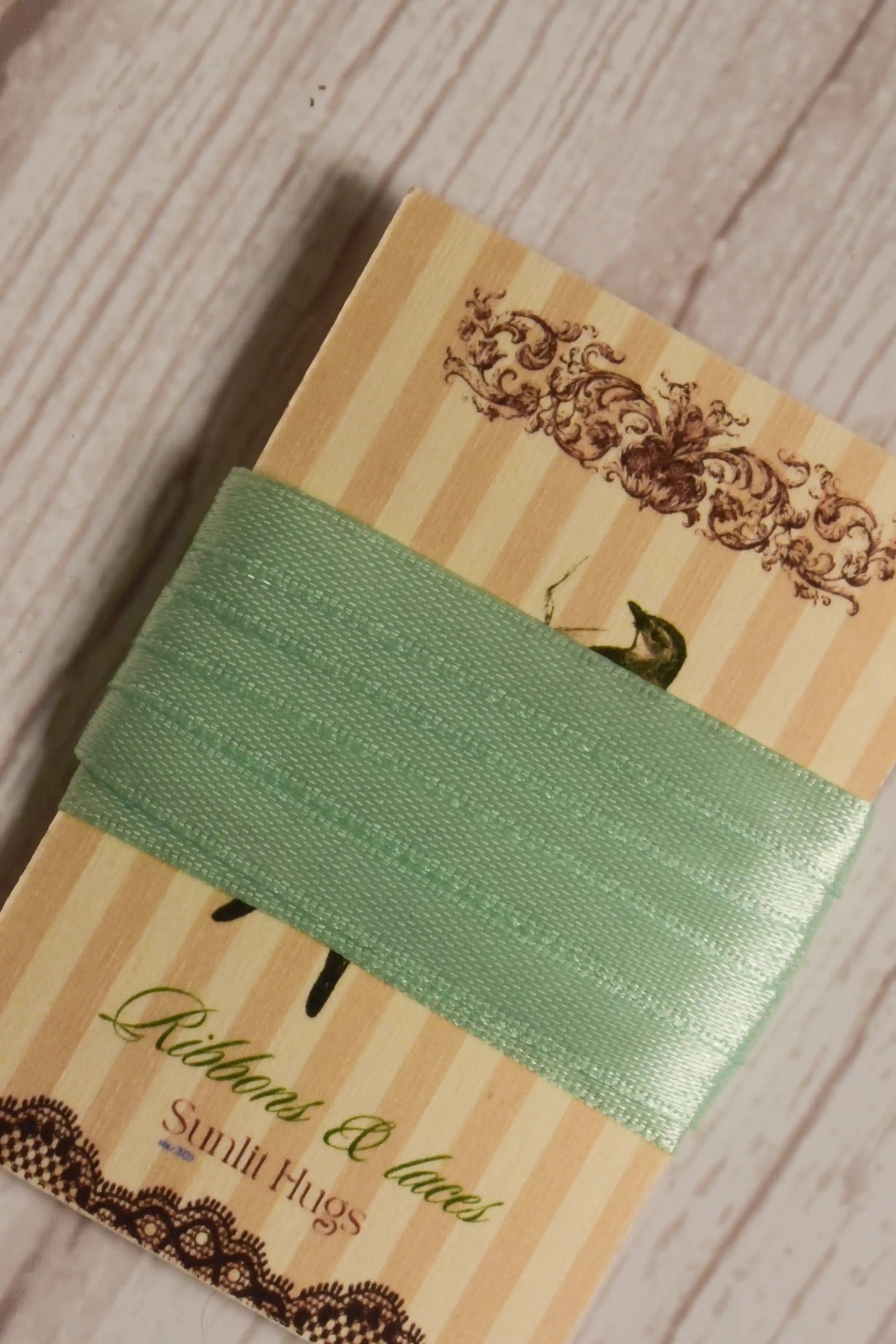 Close-up of Mint Breeze Ribbon displayed on a Sunlit Hugs card, highlighting its mint green tone and smooth decorative finish.