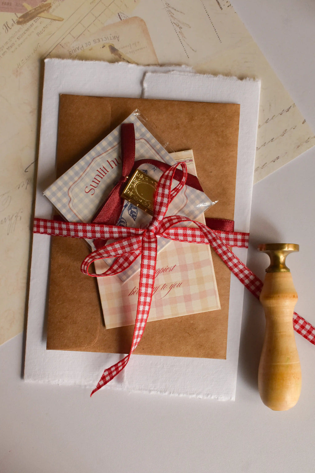 Thoughtful birthday gift featuring a custom photo pendant, poetry postcards, and a romantic vintage letter.
