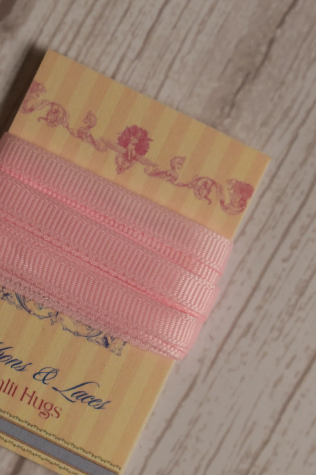 Close-up of Petal Silk Ribbon displayed on a Sunlit Hugs ribbon card, showing its soft petal pink colour and narrow 6 mm width.
