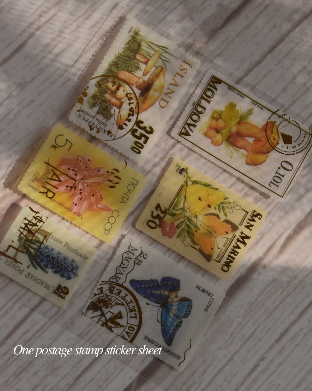 Collection of postage stamp stickers on a textured surface