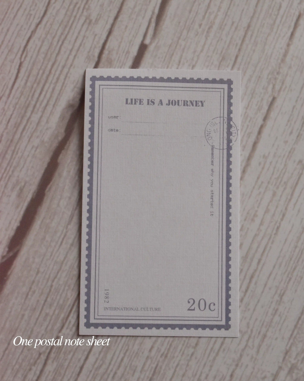 Postal note sheet with 'Life is a Journey' text on a textured surface
