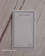 Postal note sheet with 'Life is a Journey' text on a textured surface