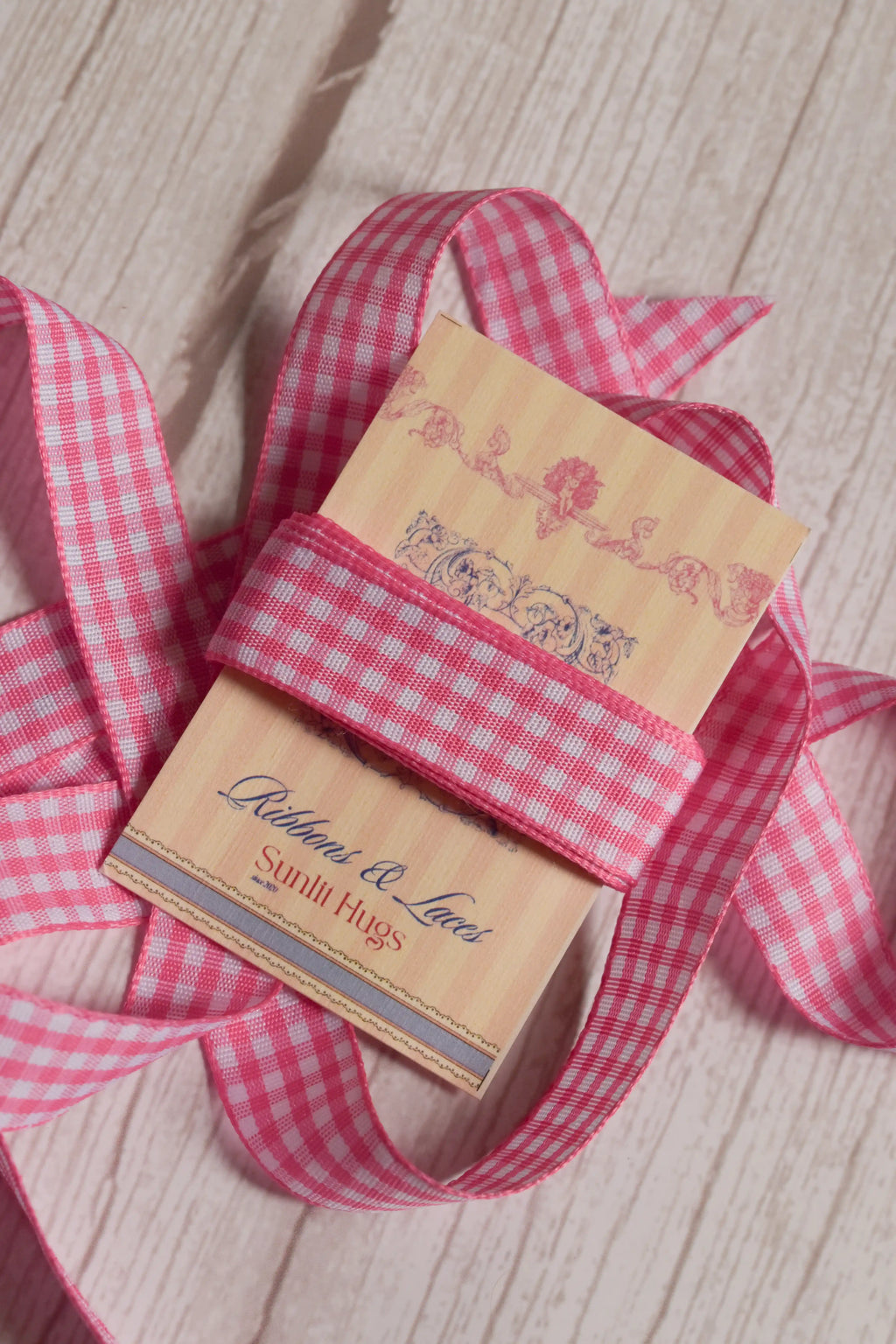 Rose Picnic Ribbon shown with loose checked ribbon strands around the product card, suitable for craft projects, packaging, scrapbooking, and decorative bows.