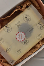 This view assures the customer of the premium presentation, showing the silhouette portrait carefully wrapped in branded tissue paper inside a secure box, ready to be sent as a thoughtful gift.