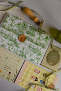 Vintage-inspired birthday gift collection with meaningful paper keepsakes and greeting card.