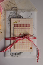 A close-up of the Timeless Love Birthday Bundle showcasing a personalised Classic Scarlet Letter alongside thoughtful birthday stationery, creating a meaningful keepsake gift for someone special.