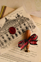 This image displays the Ink and Whimsy Letter sealed with the Cherry Wine wax stamp over the detailed vellum architectural overlay, emphasizing the stunning, artistic elegance of this old-world relic.