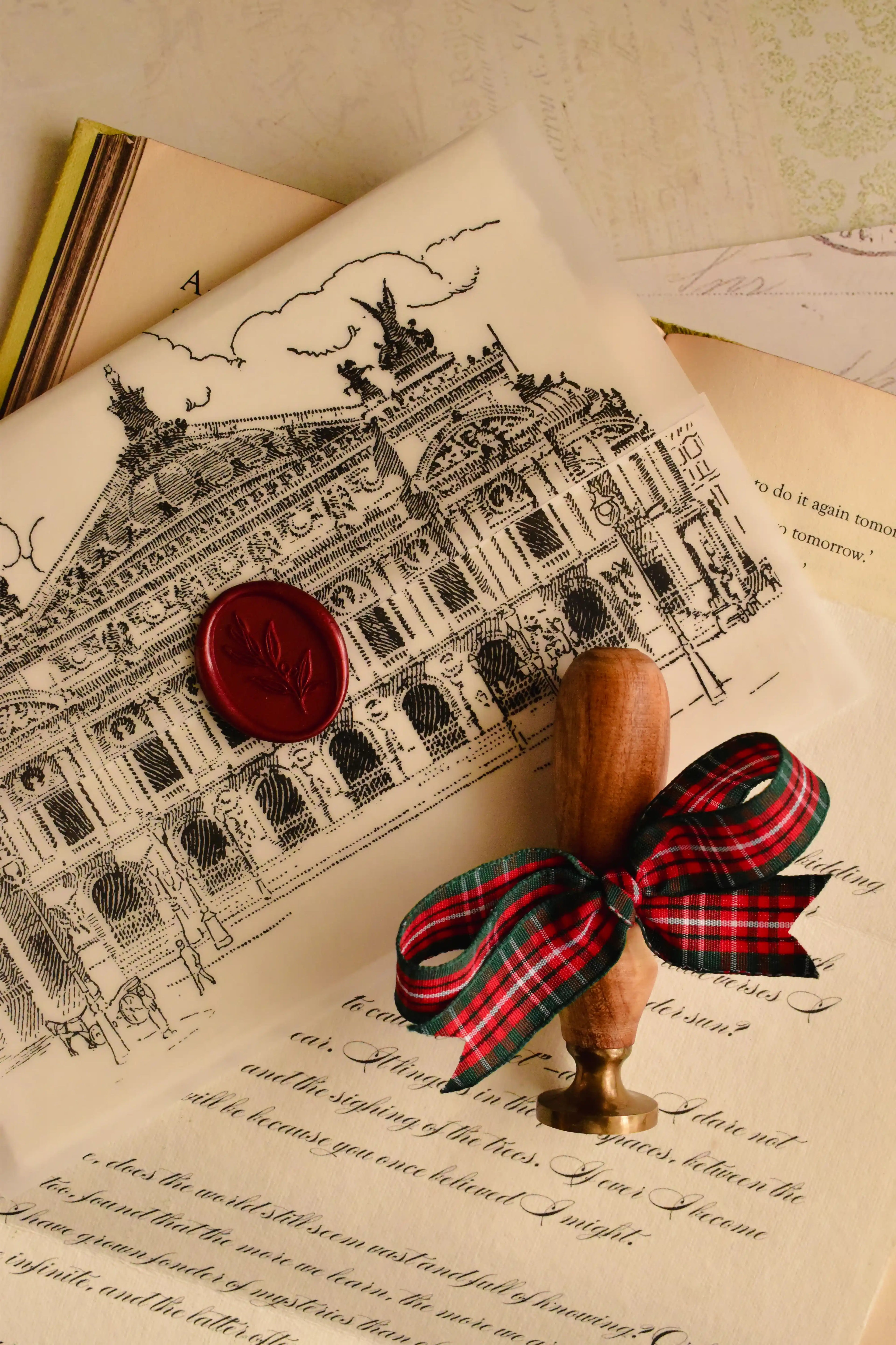 This image displays the Ink and Whimsy Letter sealed with the Cherry Wine wax stamp over the detailed vellum architectural overlay, emphasizing the stunning, artistic elegance of this old-world relic.