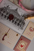 A vintage-inspired birthday gift bundle featuring the Classic Scarlet Letter, I Just Called To Say I Love You Postcard, Mi Amor Por Ti Greeting Card and Happiest Birthday To You Mini Greeting Card, designed to create lasting memories.