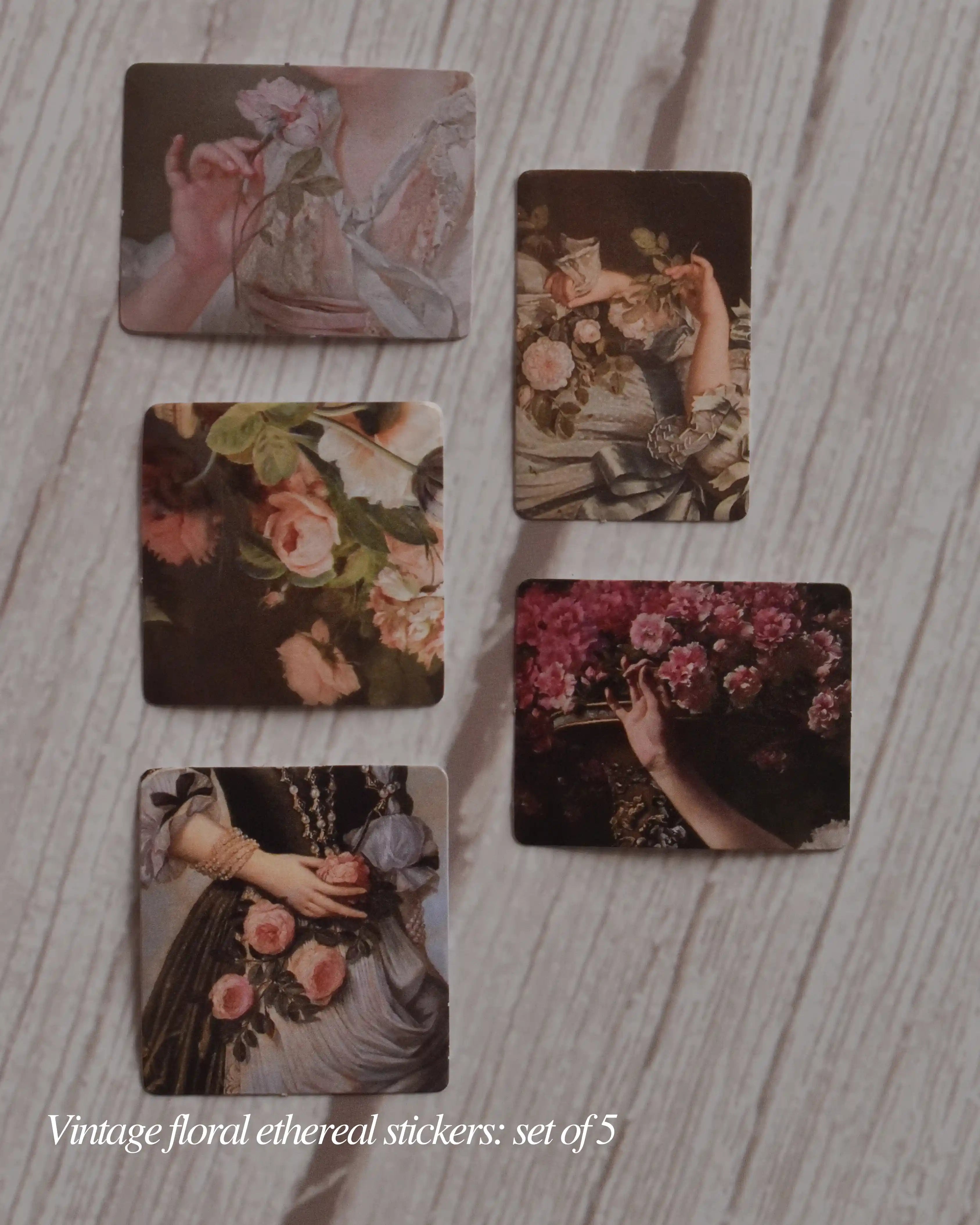 Set of five vintage floral stickers on a wooden surface