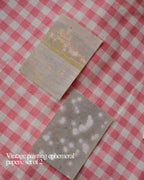 Set of two translucent vintage painting ephemeral papers, featuring faded scenes of water and flowers.