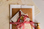 Romantic birthday keepsake bundle including a personalised pendant, birthday card, wax-sealed letter, and vintage-inspired paper goods.