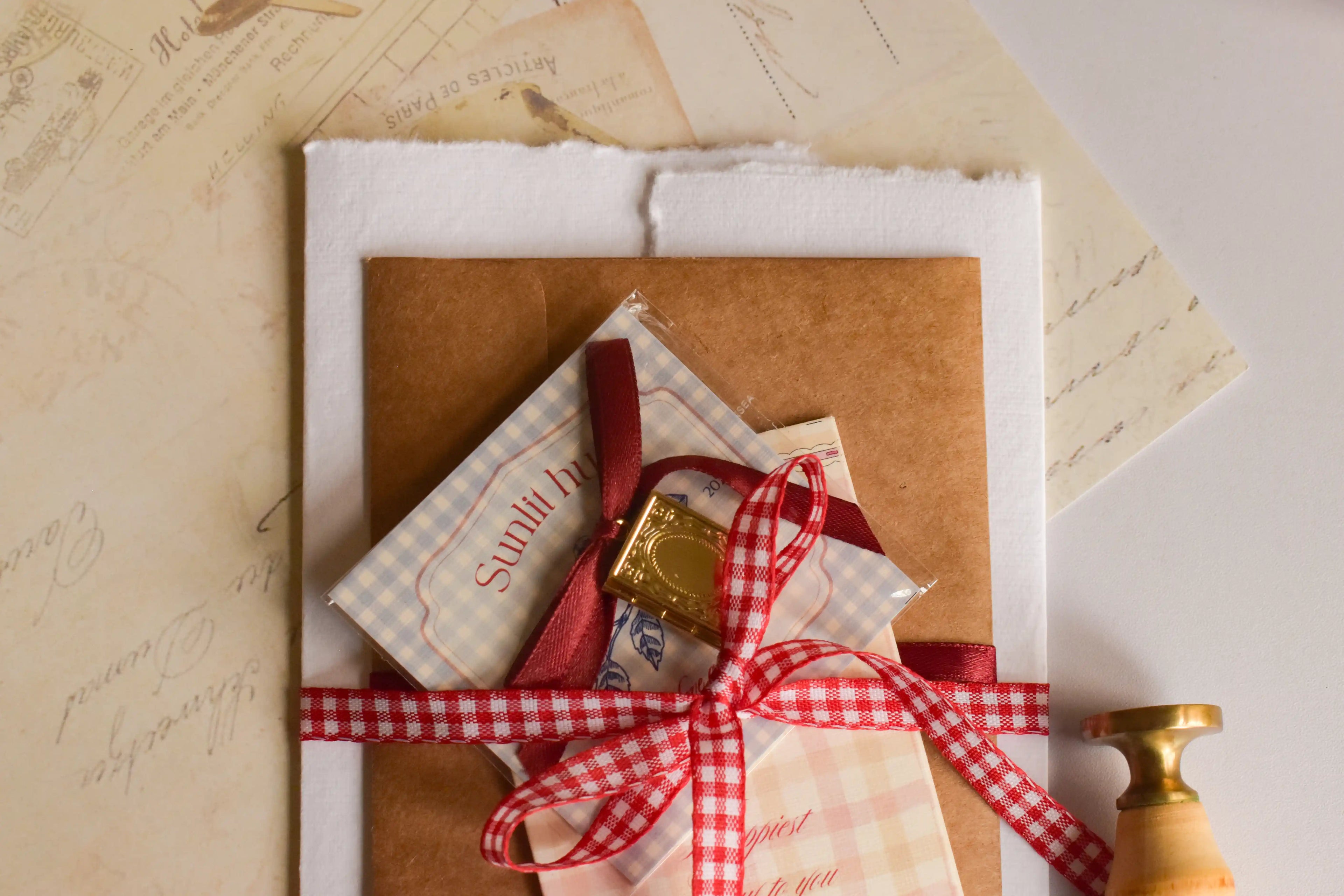 Romantic birthday keepsake bundle including a personalised pendant, birthday card, wax-sealed letter, and vintage-inspired paper goods.