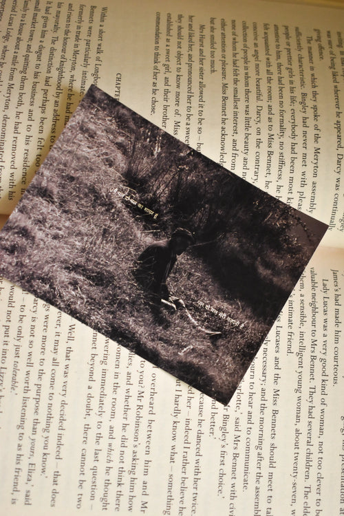 Flat lay of the Wisdom of the Hills Chakrata Portrait Photo Print displayed on an open vintage book, capturing the timeless Himalayan portrait and poetic Hindi text overlay.