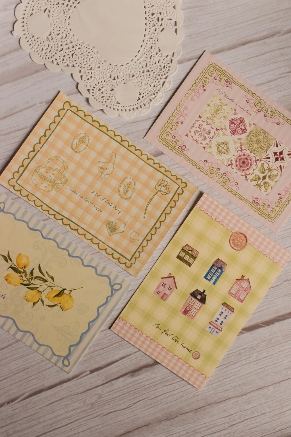 A close-up view of the Vintage Postcard Set of 4 highlighting delicate illustrations, pastel colour palettes and premium textured paper. These aesthetic postcards make thoughtful stationery gifts, scrapbook additions and timeless keepsakes.