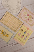 A close-up view of the Vintage Postcard Set of 4 highlighting delicate illustrations, pastel colour palettes and premium textured paper. These aesthetic postcards make thoughtful stationery gifts, scrapbook additions and timeless keepsakes.