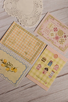 A close-up view of the Vintage Postcard Set of 4 highlighting delicate illustrations, pastel colour palettes and premium textured paper. These aesthetic postcards make thoughtful stationery gifts, scrapbook additions and timeless keepsakes.