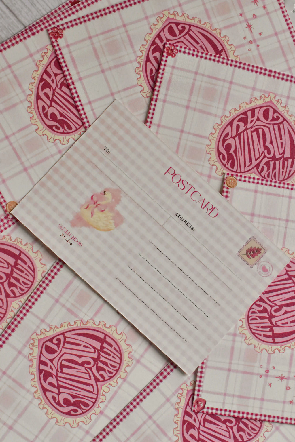 A pink gingham Happy Valentine's Day postcard features a retro heart and swan design.
