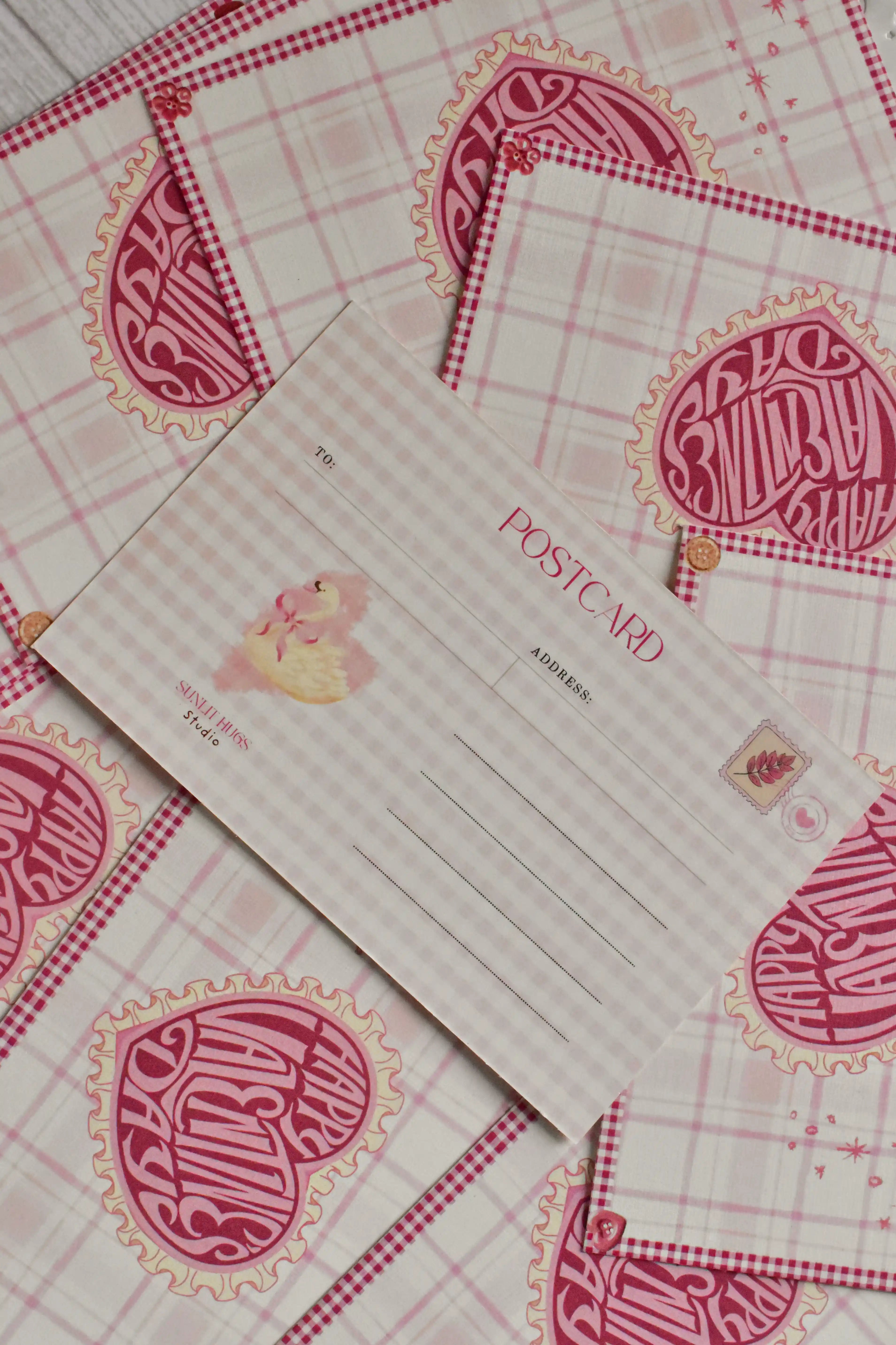 A pink gingham Happy Valentine's Day postcard features a retro heart and swan design.