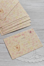 A vintage telephone love postcard is displayed with pink gingham details and romantic retro stationery styling.