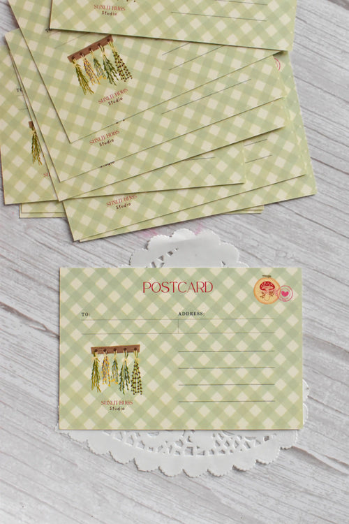 A cottagecore green gingham postcard reads Not a Bouquet with a garden-inspired floral design.