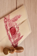 A personalized vintage love letter is displayed with soft romantic styling and a handcrafted red wax seal.