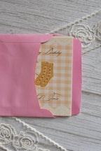 A Sock Twin happy birthday mini card sits partially tucked inside a bright pink envelope.