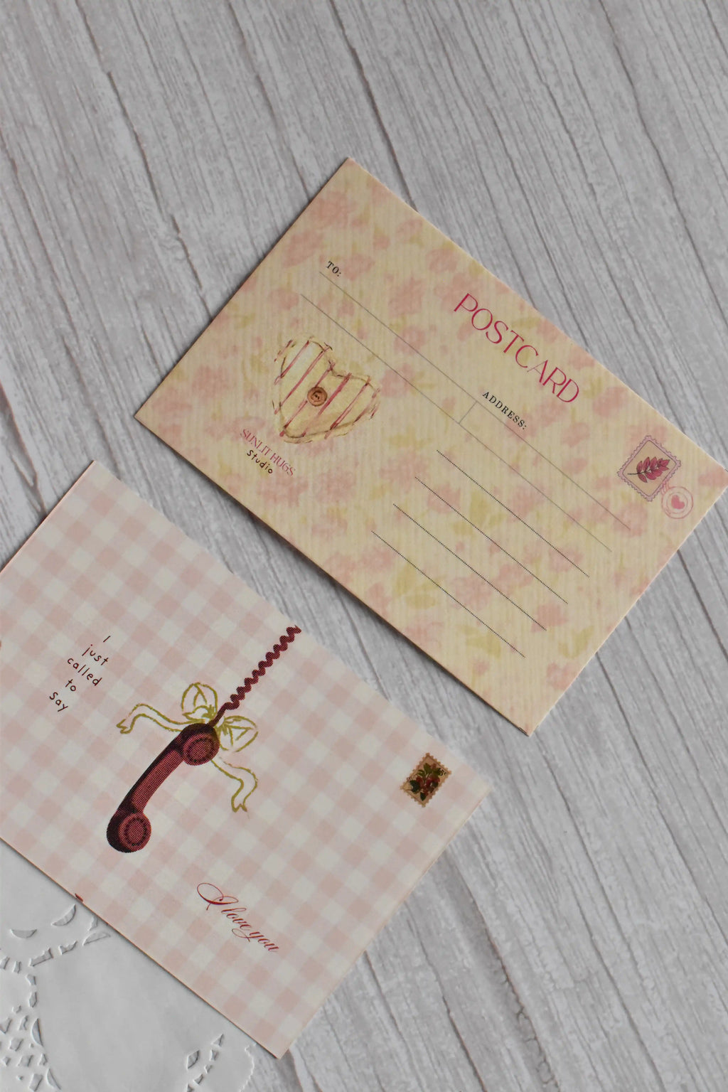 A vintage telephone love postcard is displayed with pink gingham styling and romantic retro lettering.