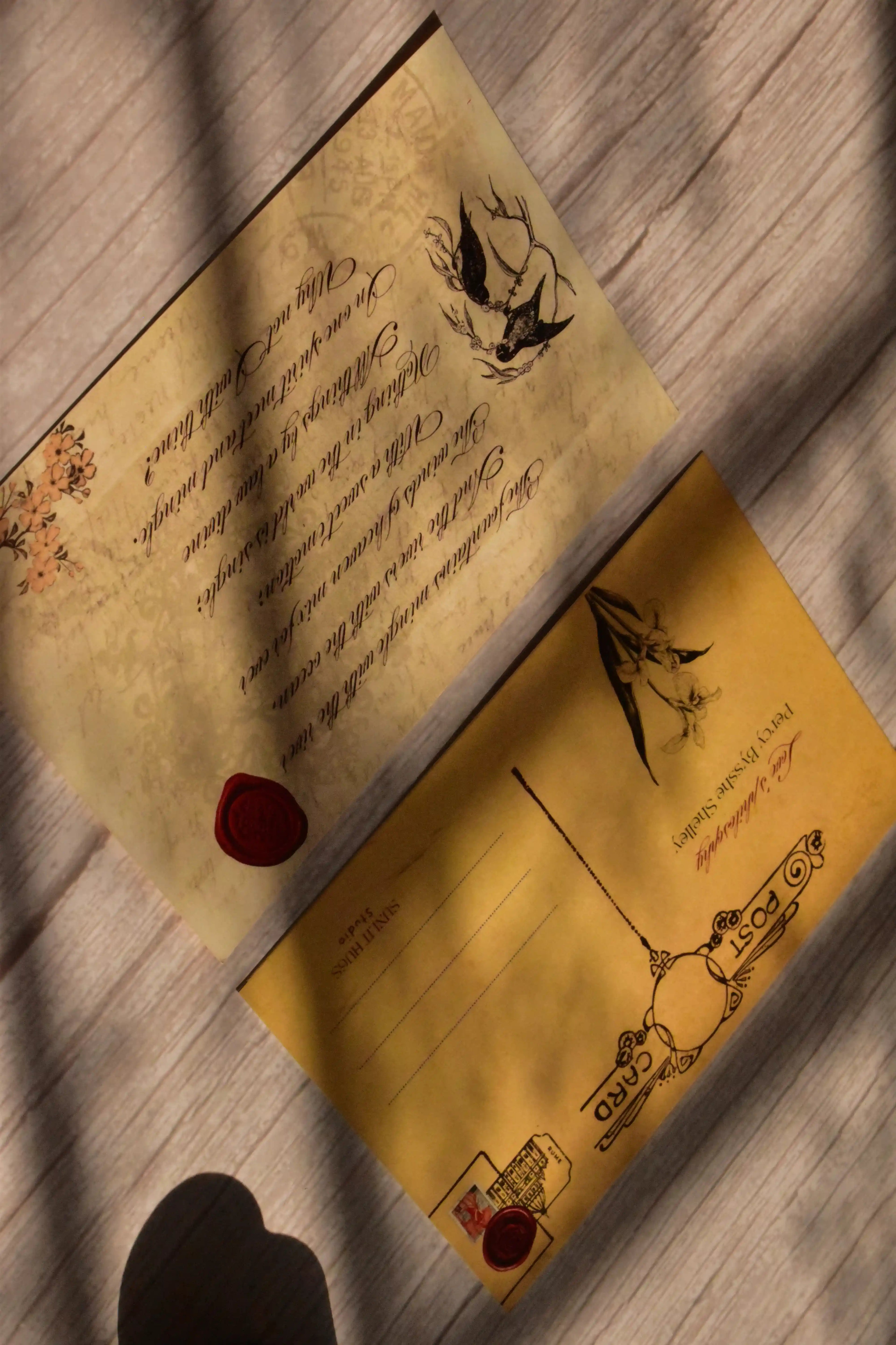 A vintage poetry postcard set is arranged with classic love poem artwork.