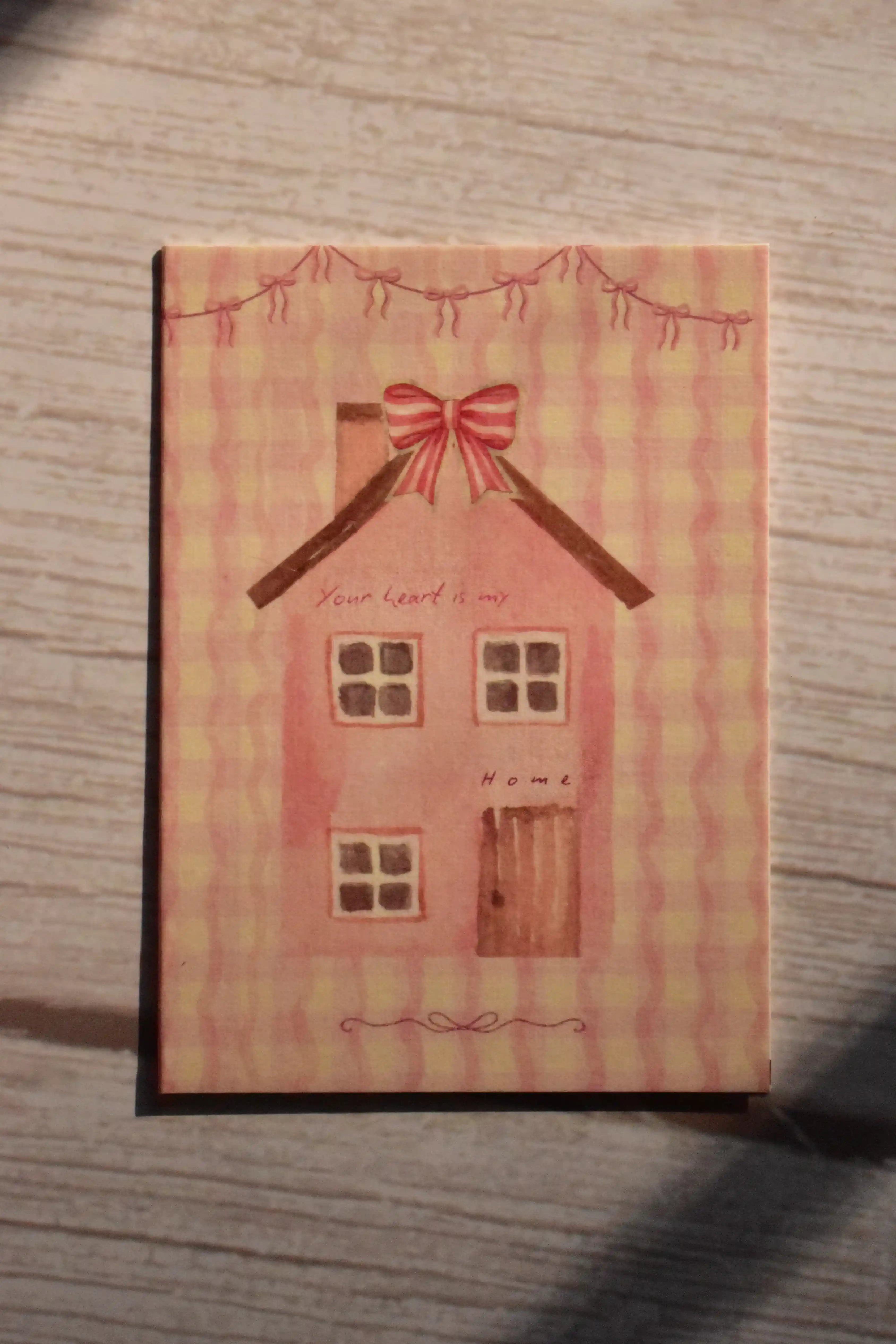 A pink mini greeting card shows a cottage illustration with a bow and the message Your Heart is My Home.