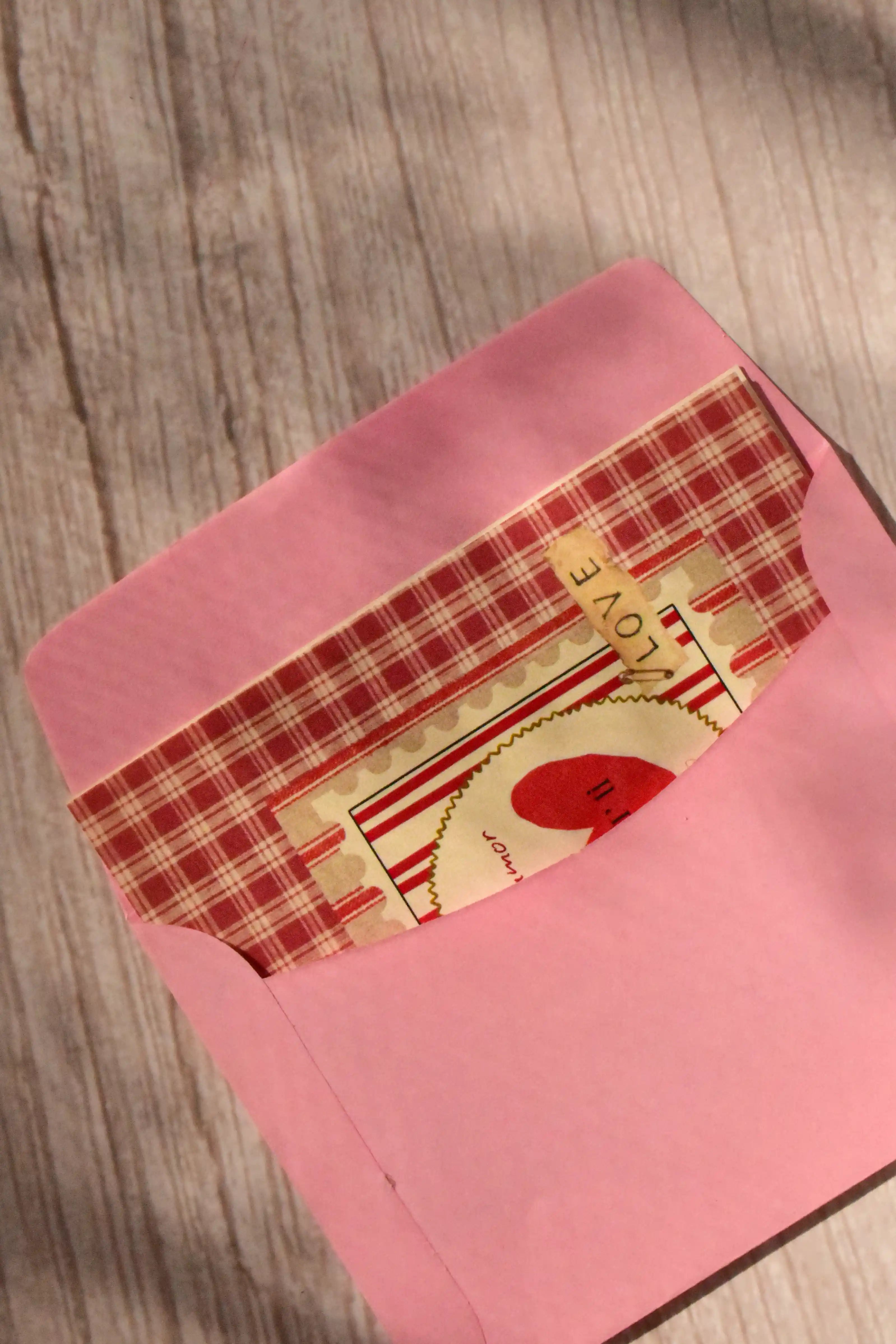 A mini Mi Amor card features red gingham, a strawberry illustration, and a pink envelope.