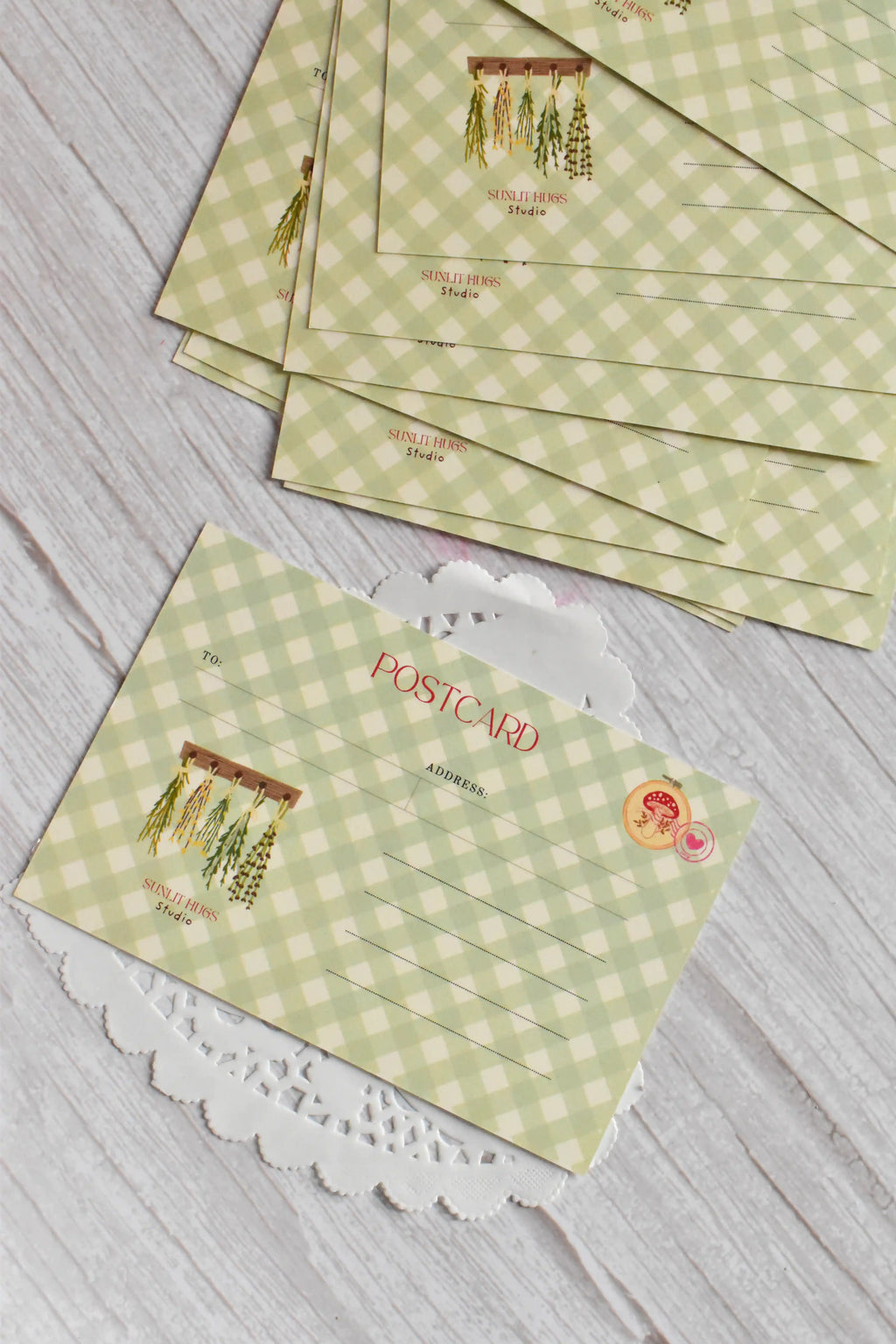 A Not a Bouquet garden postcard is styled with green gingham and vintage floral stationery details.