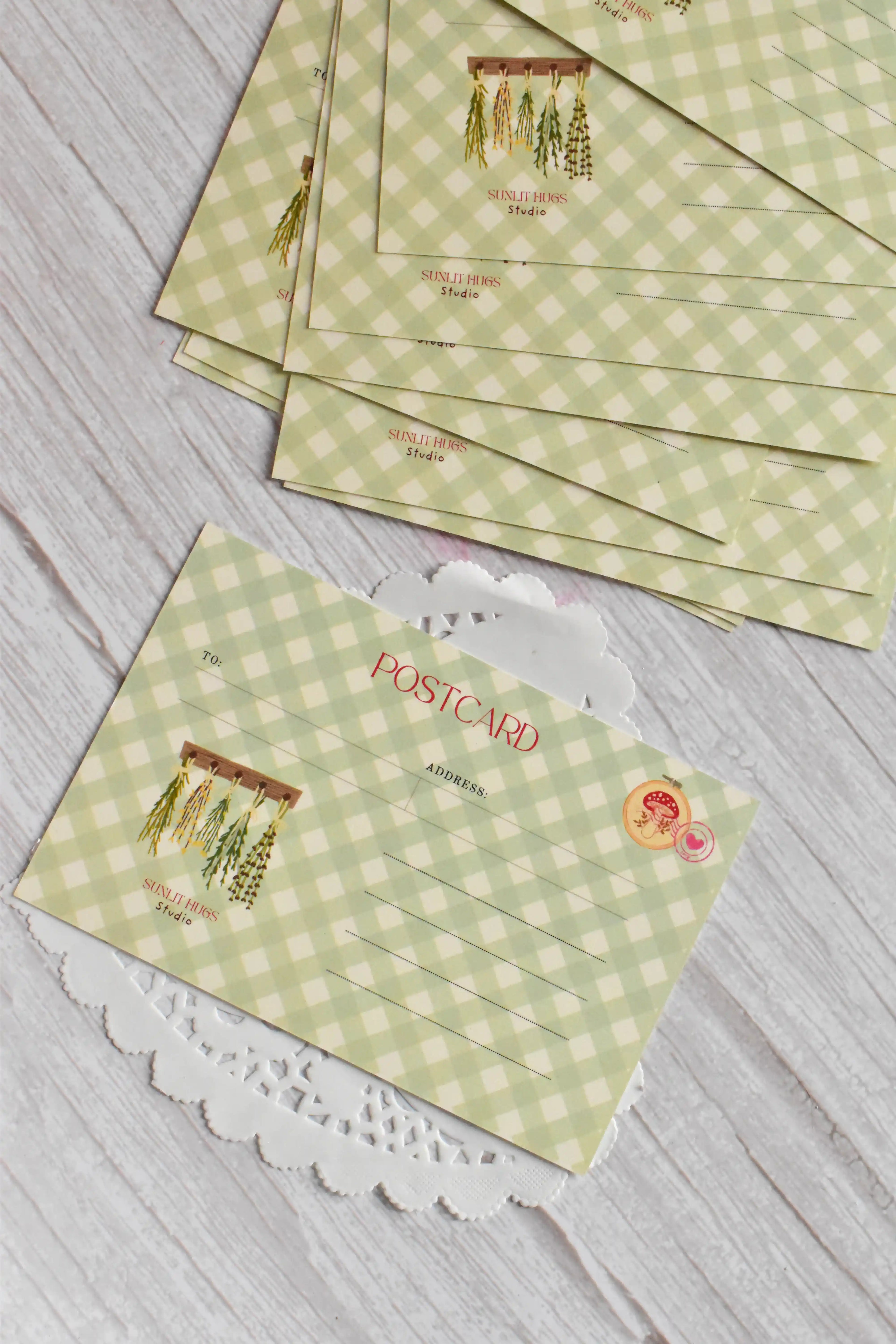 A Not a Bouquet garden postcard is styled with green gingham and vintage floral stationery details.
