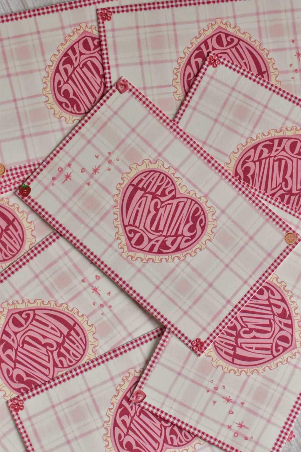 A pink gingham Valentine postcard features a retro heart and swan design.